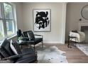 Comfortable living room boasting stylish seating, a decorative rug, and eye-catching modern artwork at 1751 S Olympian Way, Atlanta, GA 30310