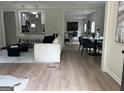 Bright living room featuring hardwood floors and an open concept design, great for entertaining at 1751 S Olympian Way, Atlanta, GA 30310