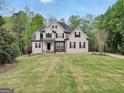 Attractive two-story home with traditional design, manicured lawn, and lovely landscaping at 70 Barrington Farms Ct, Sharpsburg, GA 30277