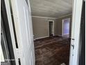 An entryway with a view into the living room and hallway at 1243 Hill Nw St, Conyers, GA 30012