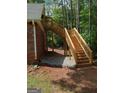 Newly constructed exterior wooden staircase leading to a private entrance of the home at 5003 Samantha Ct, Mcdonough, GA 30252