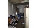 Room view showing the unkempt interior with discarded items, damaged walls, and poor conditions, requiring substantial cleanup at 950 Joseph E Boone Nw Blvd, Atlanta, GA 30314