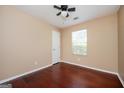 Bright bedroom featuring hardwood floors, a ceiling fan, and neutral paint at 4691 Garden Hills Ct, Stone Mountain, GA 30083