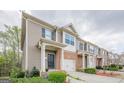 Beautiful two-story townhome with a brick and siding exterior and well-maintained landscaping at 2705 Maple Park Pl # 29, Cumming, GA 30041