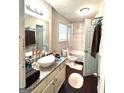 Bright bathroom featuring a modern vessel sink, granite countertops and a shower-tub combination at 579 Wexwood Dr, Riverdale, GA 30274