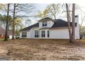Spacious backyard with ample green space and mature trees at 12711 Simmons Rd, Hampton, GA 30228