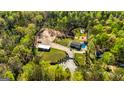 Expansive property featuring a pool, sports court, workshop, and lush surroundings at 168 Lakeview Dr, Grantville, GA 30220