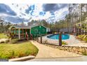 Backyard swimming pool featuring an enclosed fence for safety at 168 Lakeview Dr, Grantville, GA 30220