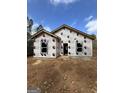New home under construction, front exterior view showcasing window placements and architectural design at 543 Courthouse Park Dr., Temple, GA 30179