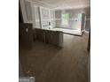 Unfinished living room features drywall, a window, and a door to the outside, ready for customization at 543 Courthouse Park Dr., Temple, GA 30179