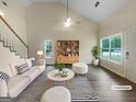 Bright living room with vaulted ceiling, stylish furnishings, and ample natural light at 7747 Roundtree Xing, Riverdale, GA 30274