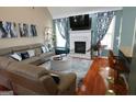Spacious living room with vaulted ceilings, a cozy fireplace, and stylish decor at 480 Meadow Sage Ln, Fayetteville, GA 30214