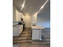 Modern kitchen featuring white cabinets, granite countertops, and new appliances at 8726 Lakeview Commons # 50, Jonesboro, GA 30238