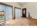 Bright living room featuring hardwood floors, sliding glass doors and large windows at 655 Sunset Dr, Locust Grove, GA 30248