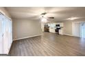 Spacious open-concept living room with hardwood floors that flows into a modern kitchen at 2942 Elkhorn Ct, Decatur, GA 30034