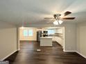 Open-concept living room flows into kitchen with stainless steel appliances and center island at 6026 S Bear Dr, Douglasville, GA 30135