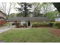 A well maintained one story brick home with a front yard at 3578 Sherbrooke Sw Way, Atlanta, GA 30331