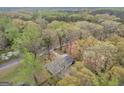 Birds eye view shows a secluded home nestled amongst mature trees and beautiful surroundings at 2694 Benjamin E Mays Sw Dr, Atlanta, GA 30311
