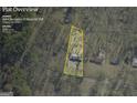 Aerial view of property outline, showing the home's location on a large lot surrounded by trees at 2694 Benjamin E Mays Sw Dr, Atlanta, GA 30311
