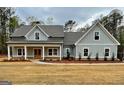 Craftsman home with a welcoming front porch and meticulously landscaped front yard at 4585 Parkwood Rd, Social Circle, GA 30025