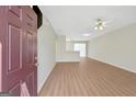 Bright, open living space features hardwood floors and neutral paint at 7112 Brookview Way, Riverdale, GA 30274