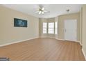 Spacious living room features hardwood floors and lots of natural light at 7112 Brookview Way, Riverdale, GA 30274