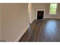 Living room features a fireplace and hardwood flooring at 3383 Milan Ct # 4 Plapprox Sqft 1, Douglasville, GA 30135