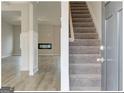 Inviting entryway with hardwood floors, staircase and view of living room at 300 San Anselmo St, Locust Grove, GA 30248