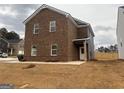 Two-story home showcasing brick and gray siding, plus a manicured lawn at 5301 Tolar Rd # 95, South Fulton, GA 30213