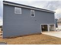 Home featuring gray siding and an attached garage, all on a spacious lot at 5301 Tolar Rd # 95, South Fulton, GA 30213