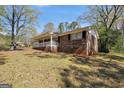 Exterior view of house showing brick facade and covered front porch at 736 Stagecoach Rd, Stockbridge, GA 30281