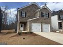 Charming two-story brick home with two-car garage and traditional design in a residential neighborhood at 5318 Tolar Rd # 25, South Fulton, GA 30213