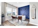 Stylish office space featuring a blue accent wall, modern desk, and natural light at 5326 Tolar Rd # 29, South Fulton, GA 30213