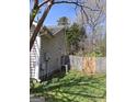 Side view of a house with a small fenced area, an air conditioning unit and wood privacy fence at 172 Willow Springs Ln, Stockbridge, GA 30281