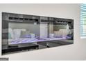 Modern electric fireplace with blue flame display against a white wall at 5364 Tolar Road # 74, South Fulton, GA 30213
