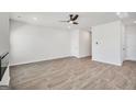 Spacious living room featuring light wood floors and a modern ceiling fan at 5364 Tolar Road # 74, South Fulton, GA 30213