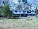Charming two-story home featuring a stone facade and well-maintained lawn at 30 Hickory Dr, Stockbridge, GA 30281