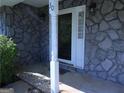 Close-up of a porch of the house with natural stone facade at 30 Hickory Dr, Stockbridge, GA 30281