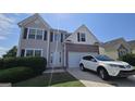 Charming two-story home featuring neutral siding, brick accents, and a well-maintained front yard at 771 Franklin Mill Trce, Loganville, GA 30052