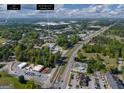 Aerial view showcasing the property's proximity to major roads and nearby commercial areas for convenient accessibility at 174 E Broad St, Fairburn, GA 30213