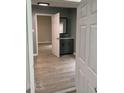 Neutral bathroom featuring a modern vanity with a black faucet and a large mirror at 116 Stewart Ave, Jonesboro, GA 30236