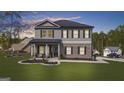 Charming two-story home featuring gray siding, brick accents, and a welcoming front porch with elegant columns at 924 Bryson Lake Cir, Douglasville, GA 30134
