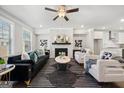 A well-decorated living room boasts a stone fireplace, sleek furniture, and a contemporary rug at 1341 Rosen Rd, Brookhaven, GA 30319