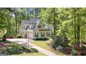 Beautiful home featuring dark shutters, an attached garage, and a well-manicured lawn at 210 Sweetwater Dr, Fayetteville, GA 30214