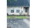 Charming townhome exterior with light siding, well-maintained lawn, and inviting front door at 6183 Field Stone Dr, Douglasville, GA 30134