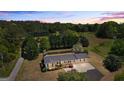 Beautiful aerial view of a single-story home with mature trees on a large lot at 424 N Green Cir, Mcdonough, GA 30252