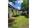 The backyard shows a well maintained lawn with some plants at 6127 Floyd Ne St, Covington, GA 30014