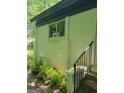 Exterior entrance with stairs, showing brick wall and some plants at 6127 Floyd Ne St, Covington, GA 30014
