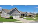 A well kept house features an attached two car garage and nicely landscaped yard at 1598 Renaissance Ne Dr, Conyers, GA 30012