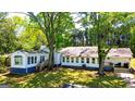 Exterior view of a one-story home with multiple windows and a cozy porch at 20 Rosser Rd, Mcdonough, GA 30252